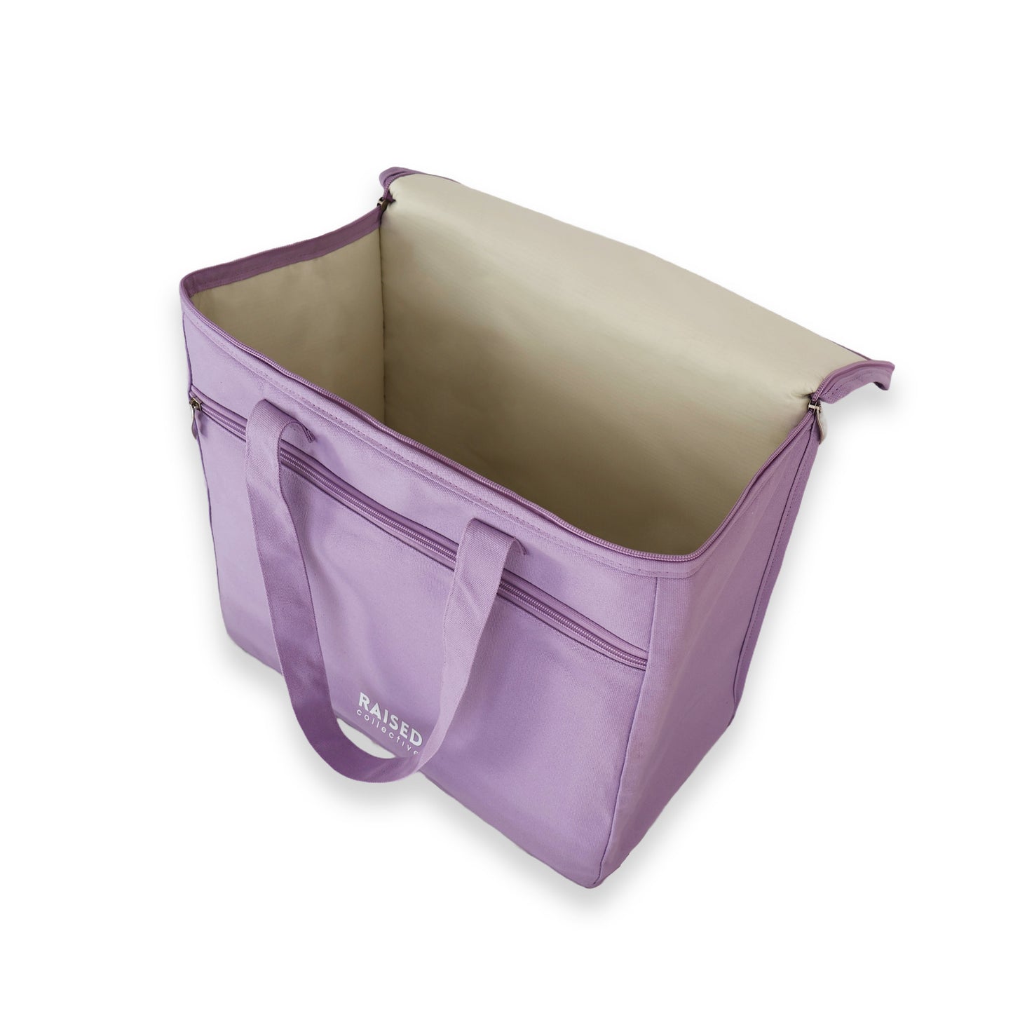 Inside view of the picnic cooler bag in lilac, large main insulated compartment and smaller front zippered compartment for keys, wallet and phone.  For beach and picnic days, buy well and buy once.