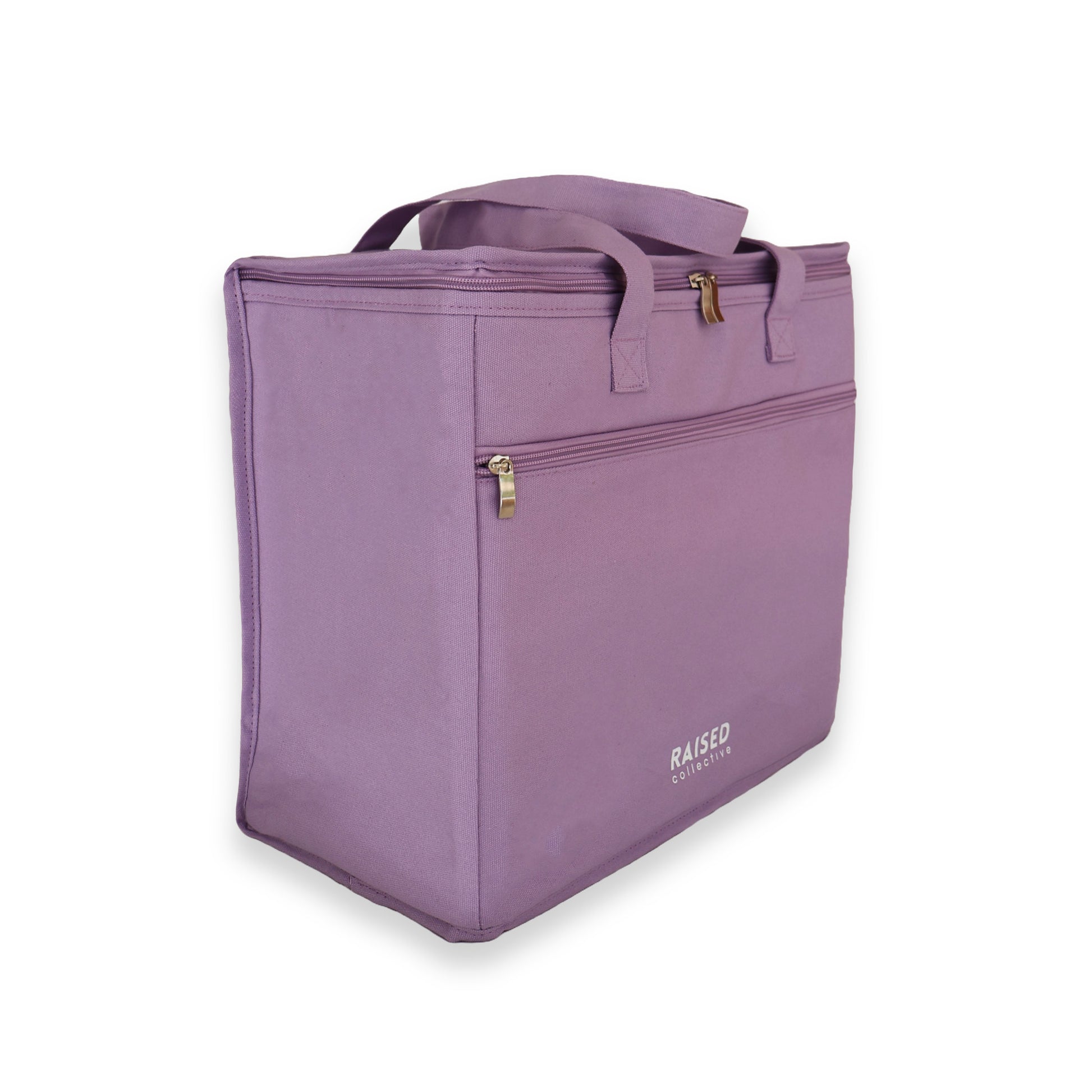 Side view of the picnic cooler bag in lilac, large main insulated compartment and smaller front zippered compartment for keys, wallet and phone.  For beach and picnic days, buy well and buy once.